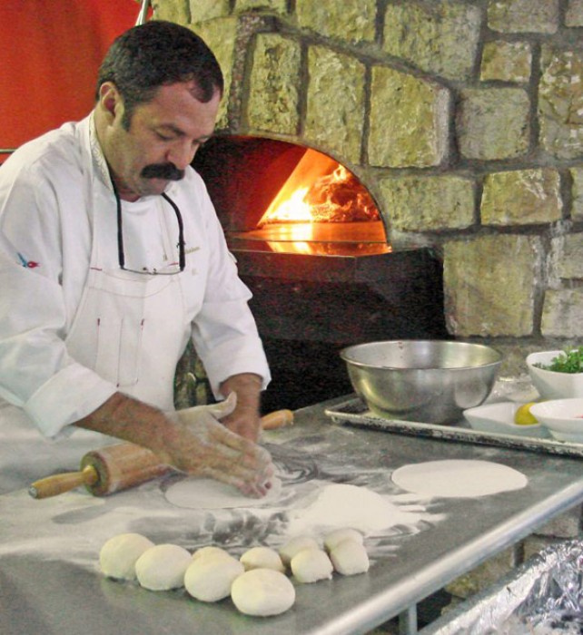 Musa Dağdeviren prepares his Lachmacun (Arab Pizza) at Graystone, in Napa, and he grills his exquisite Liver Kebap (see recipe).