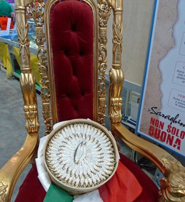Humble salted sprats are beautifully packaged and promoted under the name Saraghina, on a gilded red throne!
