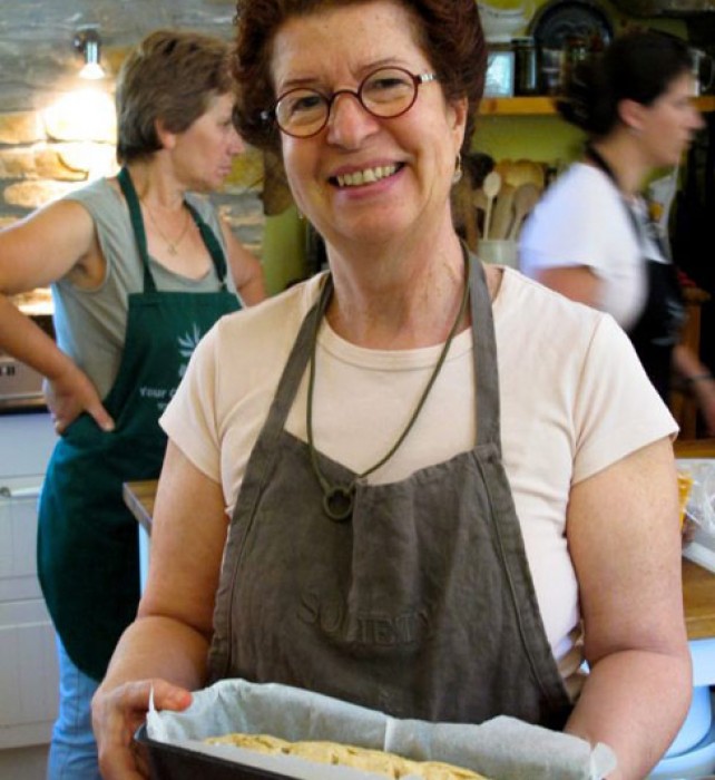 Aglaia with one of her breads just out of the oven. (Photo by Renne Iseson).